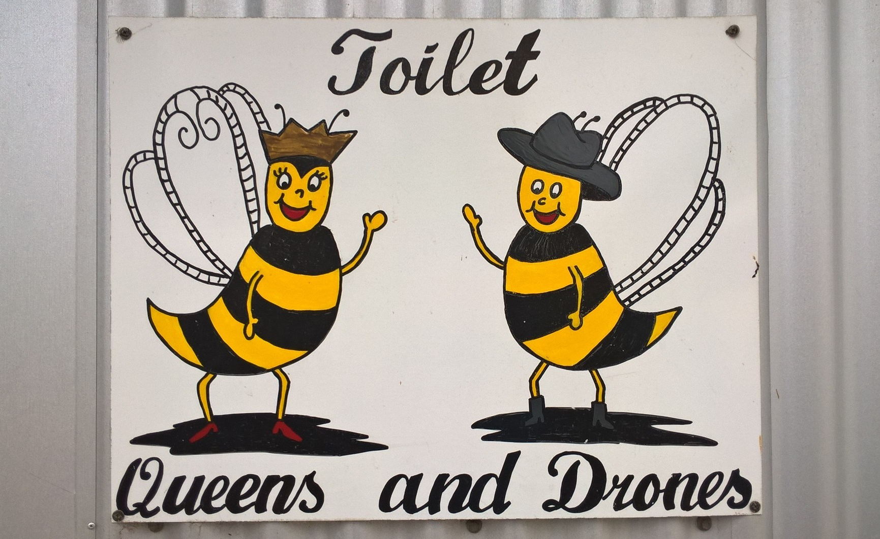 cartello toilette con api maschi e femmine